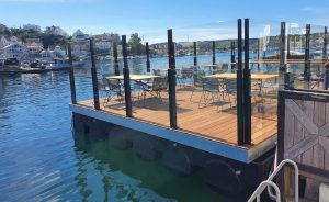 Wind barrier installation alongside water's edge.