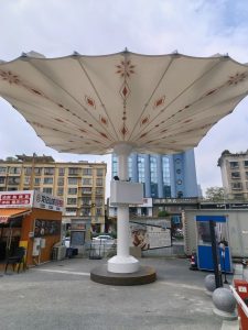 Medina giant motorized umbrella with portable steel base.
