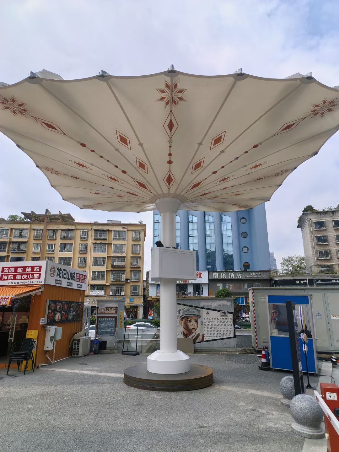 Medina giant motorized umbrella with portable steel base.